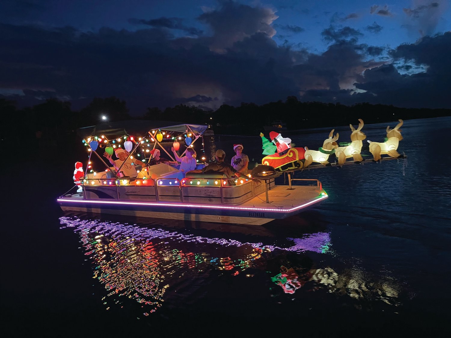 LABELLE – Holiday music and shouts of “Merry Christmas!” could be heard on shore at the boats passed. [Photo courtesy of East Coast Marine]